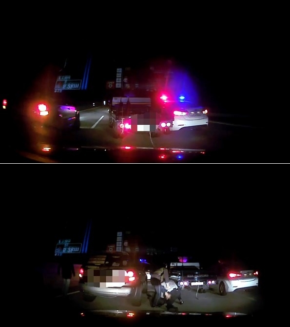 만취상태서 약 43km구간을 경찰과 심야추격전을 벌인 포터차량 운전자를 검거하고 있다.(사진제공=부산지방경찰청)