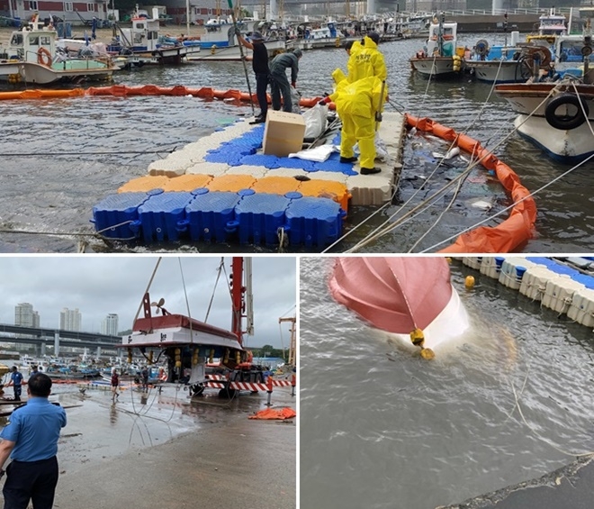전복된 어선에서 유출된 기름에 대해 긴급방제조치하고 크레인으로 인양하고 있다.(사진제공=부산해양경찰서)
