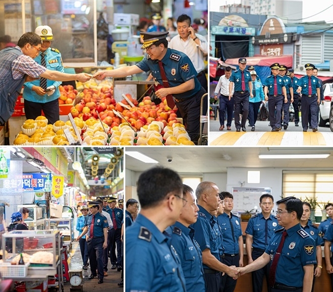 김창룡 부산경찰청장이 전통시장 상품을 구매하고 화명지구대 직원들을 격려하고 있다. (사진제공=부산경찰청)