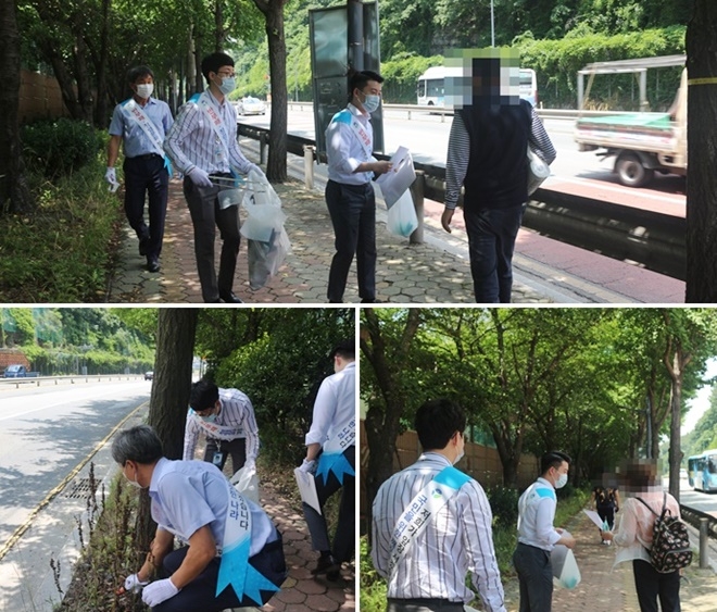 부산지부가 부산지부 인근 및 남영아파트 삼거리 일대서 청렴·반부패 캠페인과 더불어 길거리 정화작업도 하고 있다.(사진제공=한국법무보호복지공단 부산지부)