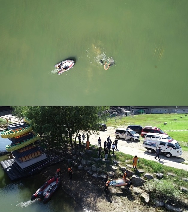 익수자를 인양해 옮기고 있다.(사진제공=진주소방서)