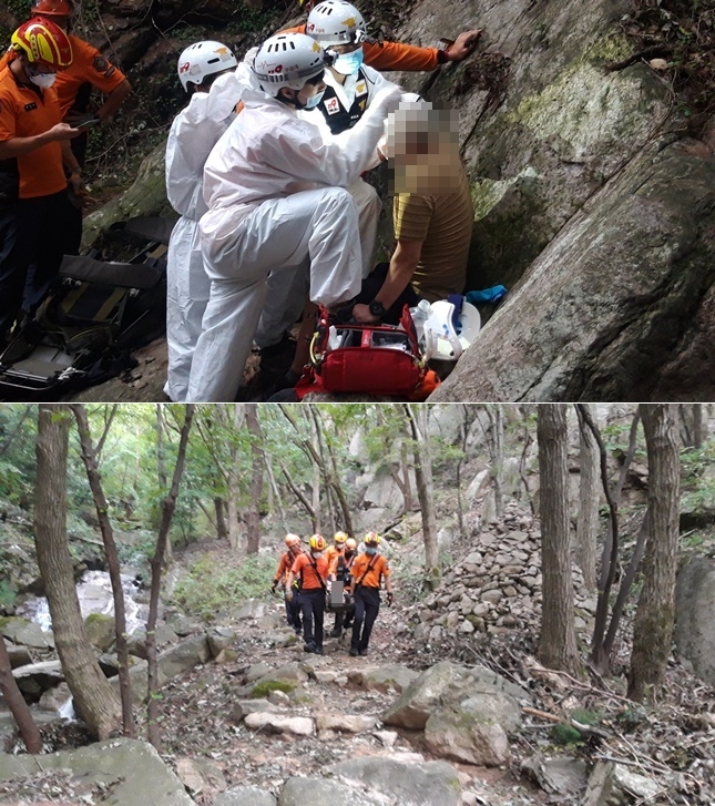 요구조자를 응급처치 후 하산하고 있다.(사진제공=부산재난소방본부)