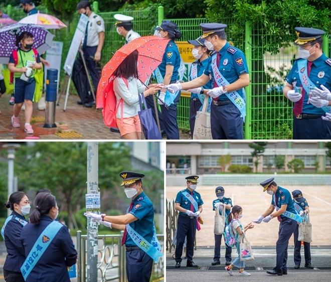 진정무 부산경찰청장이 17일 거제동 창신초등학교 등굣길 안전활동 현장 점검을 하며 아이들에게 마스크 등 홍보물을 직접 배부하고 있다. (사진제공=부산경찰청)