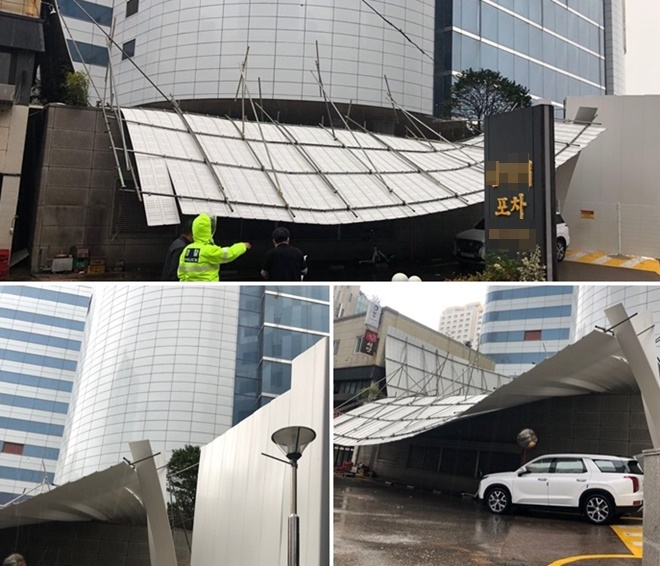 그랜드호텔 앞 공사 위해 설치해둔 펜스가 강풍으로 파손.(사진제공=부산경찰청)