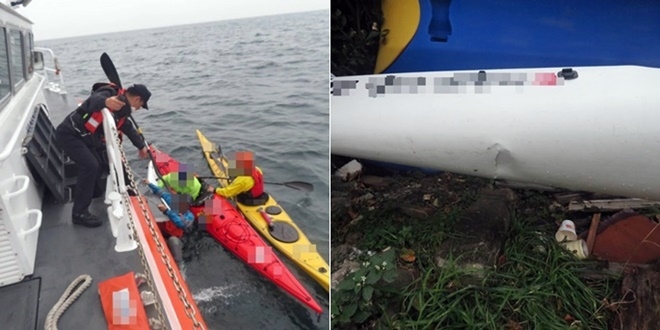 침수중인 카약 승선원을 구조하고 있다.(사진제공=부산해양경찰서)