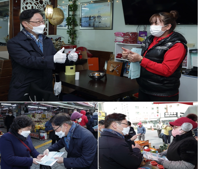 박범계 법무부장관이 음식점을 방문해 상인을 응원하고 있다. 박 장관이 현장에서 의견 등을 청취하고 마스크와 코로나19 방역 안내문을 전달하고 있다.(사진제공=법무부)