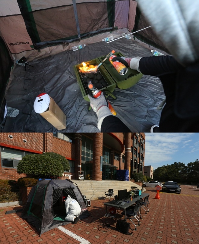 텐트 안 숯 착화 실험모습.(사진제공=부산소방재난본부)