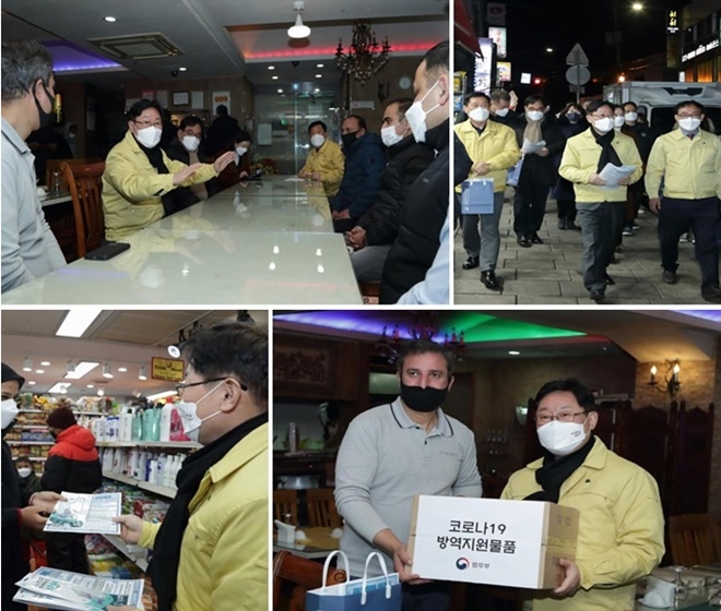 박범계 법무부장관이 서울 이태원을 방문해 현장 간담회를 갖고 코로나19 확산방지 계도활동과 방역안내문을 배포하고 방역물품(마스크)을 전달하고 있다.(제공=법무부)