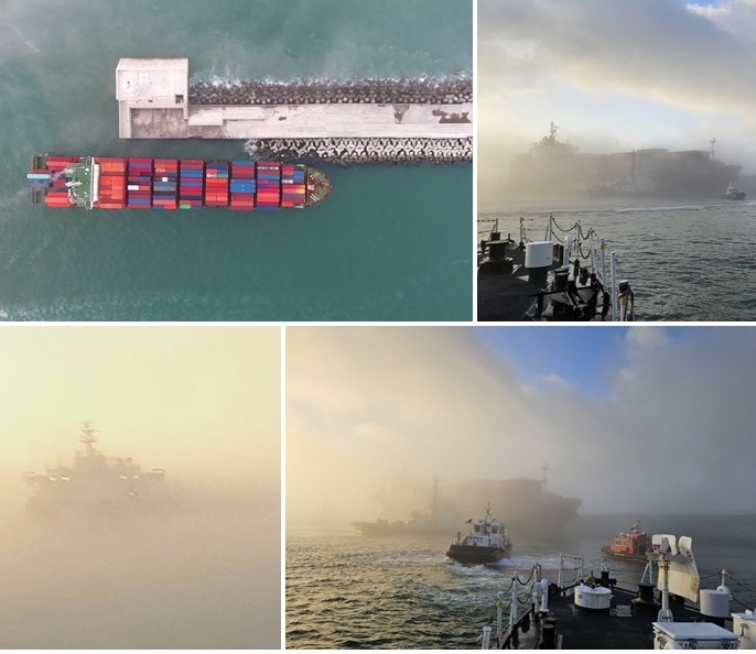 28일 부산해경이 짙은 해무가 깔려있는 가운데 부산 북항 조도방파제 끝단 좌초 선박 발생 상황 처리를 하고 있다.(사진제공=부산해경)