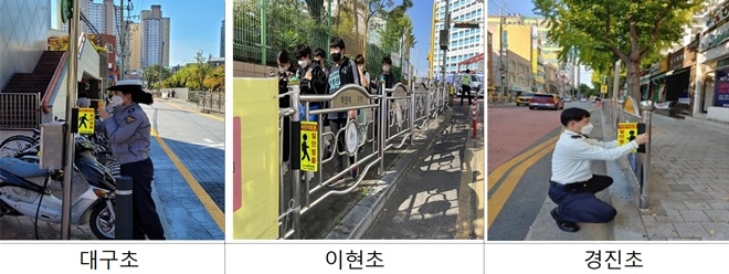 경찰이 어린이 보호반사지를 부착하고 있다.(사진제공=대구경찰청)