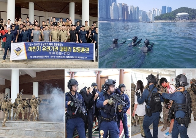남해해경청특공대와 해군특수전전단 대원들이 부상당한 민간인 인질과 각국 정상을 구출하고 있다. 해군특수전전단 대원들이해상에서 행사장으로 침투하는 테러범들을 진압하기 위해 행사장으로 진입하고 있다.(사진제공=남해지방해양경찰청)