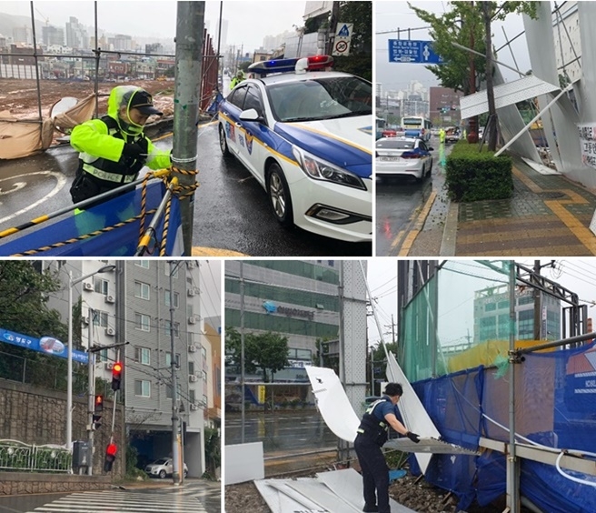 비상근무를 하며 발견한 태풍 피해현장을 수습하고 있다.(사진제공=부산경찰청)
