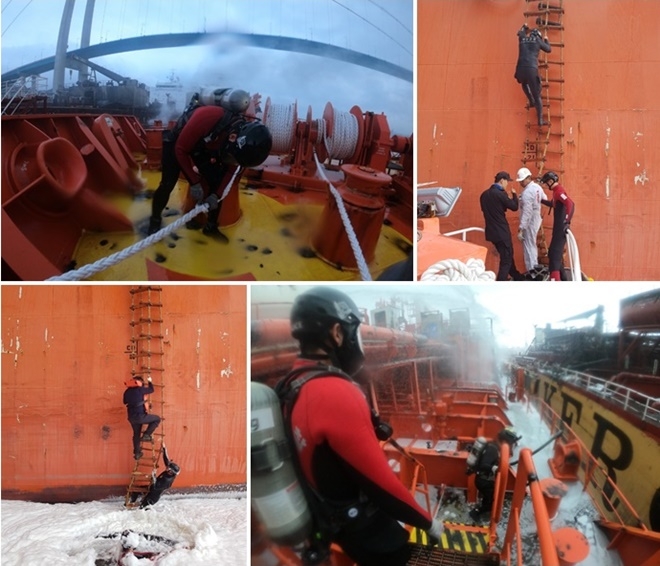 석유제품운반선 화재발생으로 홋줄 제거 등 선박분리작업을 하고 있다.(사진제공=울산해양경찰서)