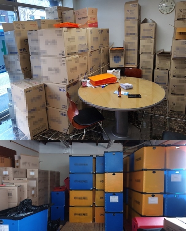 마스크를 쌓아 놓고 있다. (사진제공=부산경찰청)