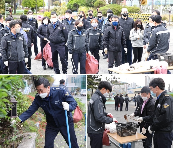 남해해경청 구자영 청장 및 직원들이 청사 화단 내 나무심기와 환경정화활동을 펼치고 있다.(사진제공=남해지방해양경찰청)
