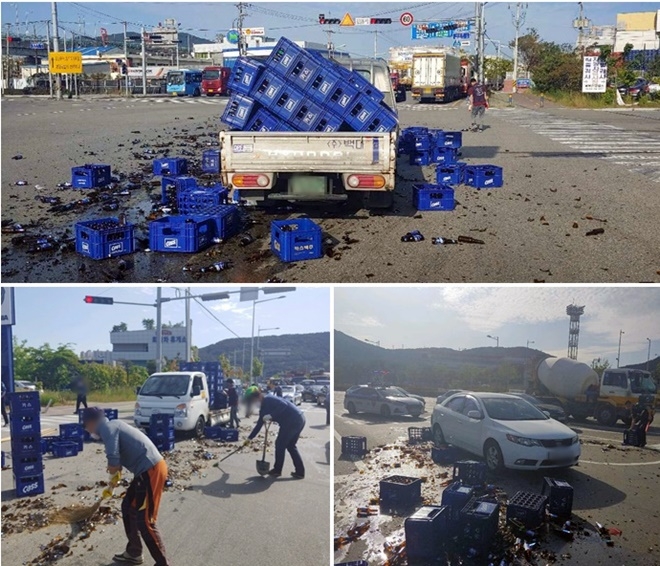 2일 오전 남구 동명부두 입구교차로서 추돌사고로 맥주 50박스가 도로에 쏟아져 치우고 있다.(사진제공=부산경찰청)