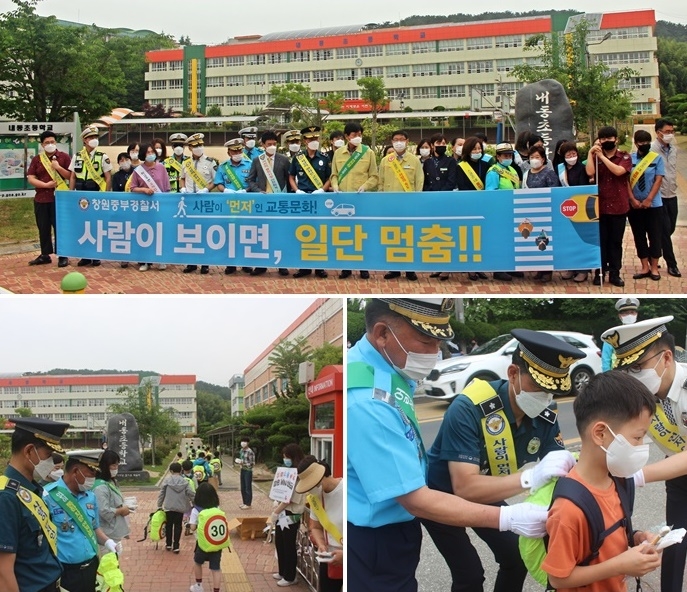 3일 김한수 서장 등이 내동초등학생에게 형광색 가방덮개를 씌워주고 있다.(사진제공=창원중부경찰서)
