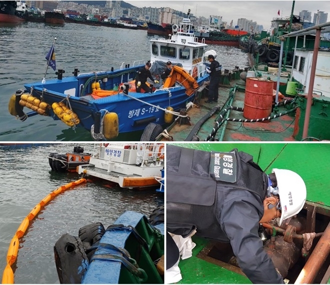 북항 5부두 물양장에 발생한 기름띠를 제거하고 있다. (사진제공=부산해양경찰서)