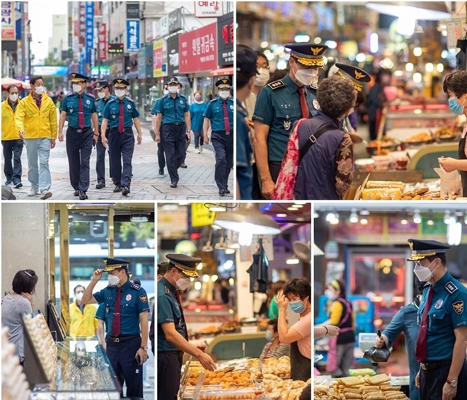 진정무 부산경찰청장이 추석명절을 맞아 골드테마거리 및 전통시장을 방문해 상인들을 격려하고 범죄취약점을 점검하고 있다.(사진제공=부산경찰청)