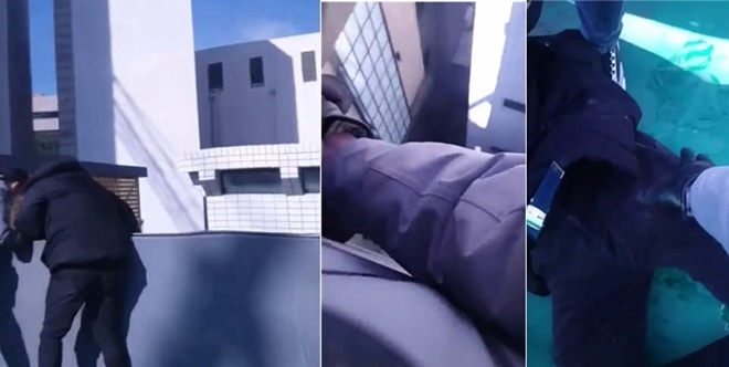 경찰들이 투신한 20대 남성의 어깨를 잡아 끌어올리고 있다. (사진제공=부산경찰청)