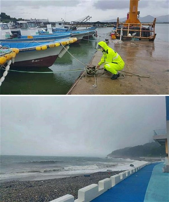 해경이 기상악화 대비 안전사고 예방을 위하여 정박선박 홋줄 보강하는 모습.(제공=부산해양경찰서)