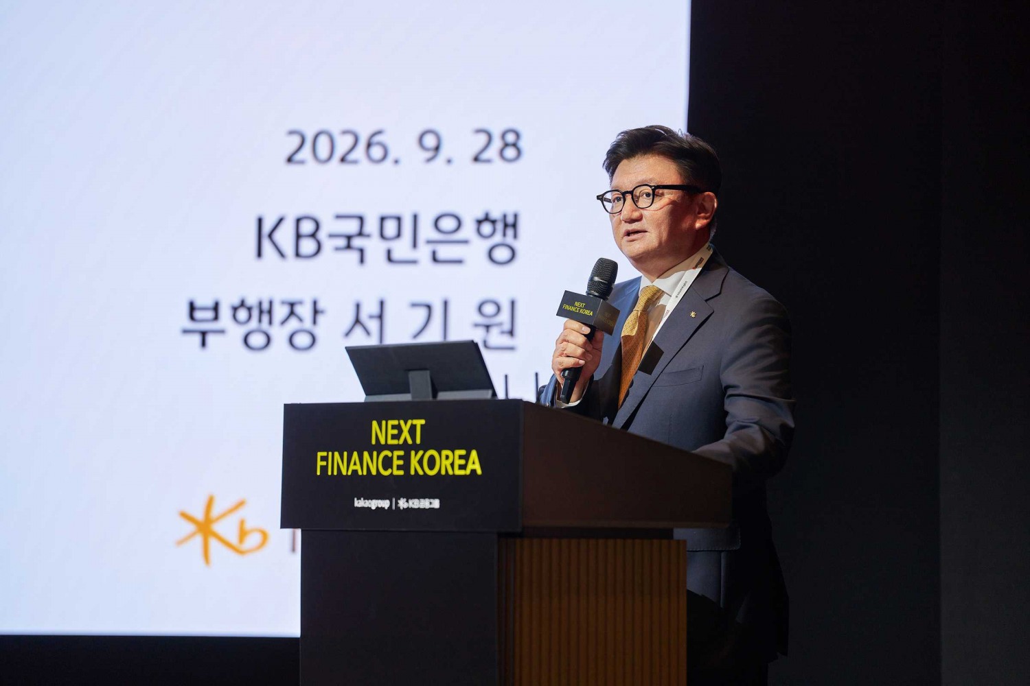 지난 28일 웨스틴 서울 파르나스에서 열린 ‘Next Finance Korea 2026’ 컨퍼런스에서 서기원 KB국민은행 경영기획그룹 부행장이 발표를 하고 있다. 사진=KB국민은행