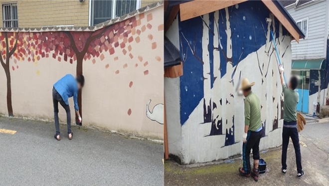 사회봉사대상자들이 벽화보수작업을 하고 있다.(사진제공=부산동부준법지원센터)