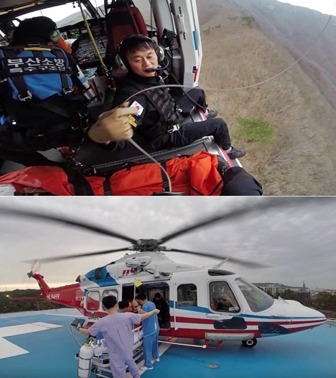 심정지환자를 헬기로 구조해 의료인에게 인계하고 있다.(사진제공=부산소방본부)