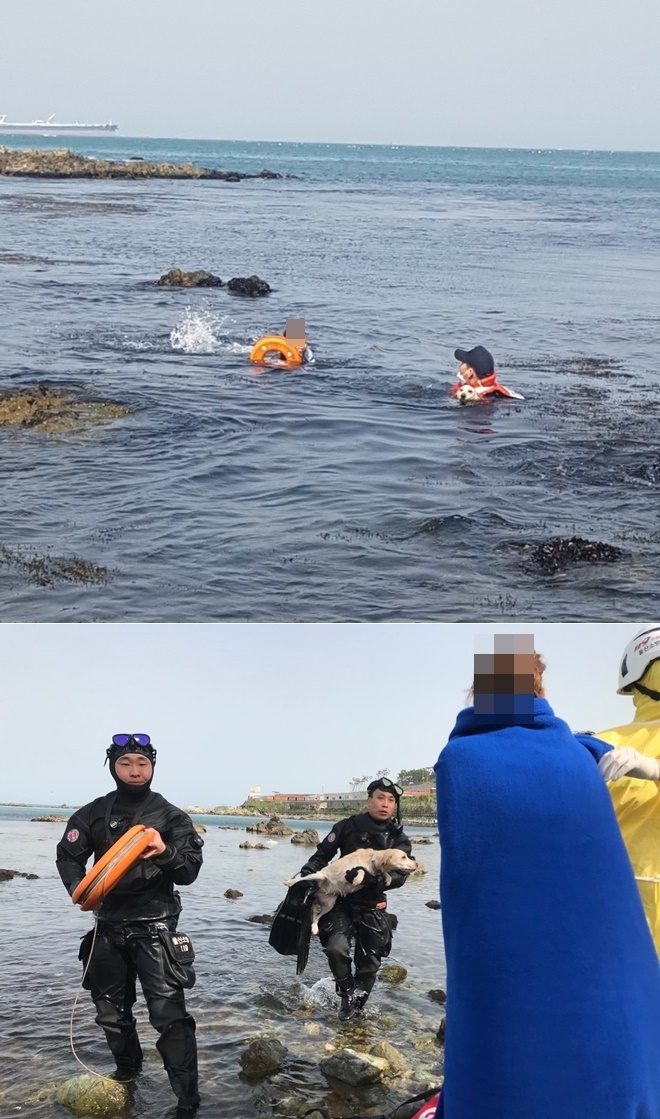 고립자(요구조자)와 반려견을 함께 구조하고 있다.(사진제공=울산해경, 온산소방서)