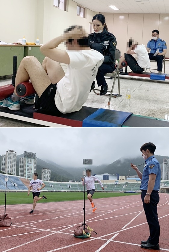 15일 오전 부산 구덕운동장에서 2020년도 제1차 해양경찰채용 체력시험 응시자들이 윗몸일으키와 달리기를 하고 있다.(사진제공=남해지방해양경찰청)