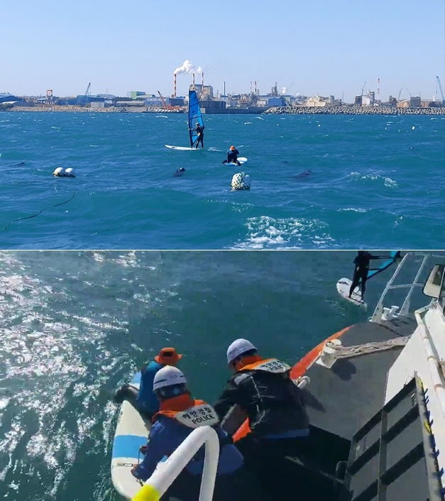 윈드서핑 표류객이 양식장 어장줄을 붙잡고 버티고 있다./해경이 윈드서핑 표류자를 구조하고 있다.(사진제공=울산해양경찰서)
